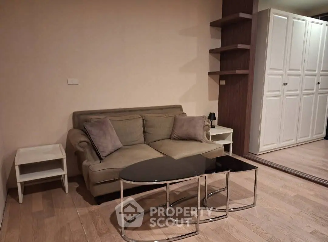 Cozy living room with modern sofa and stylish coffee table in elegant apartment.