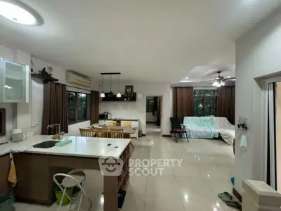 Spacious open-plan living area with modern kitchen and dining space