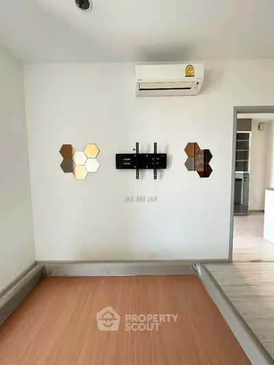 Modern bedroom with wall-mounted air conditioner and stylish decor