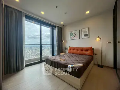 Modern bedroom with city view and stylish decor