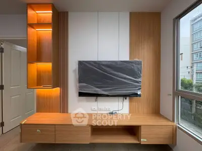 Modern living room with stylish wooden TV unit and ambient lighting