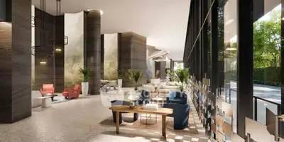 Luxurious modern lobby with stylish seating and large windows overlooking greenery.