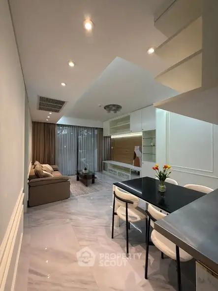 Modern living room with elegant dining area and stylish decor