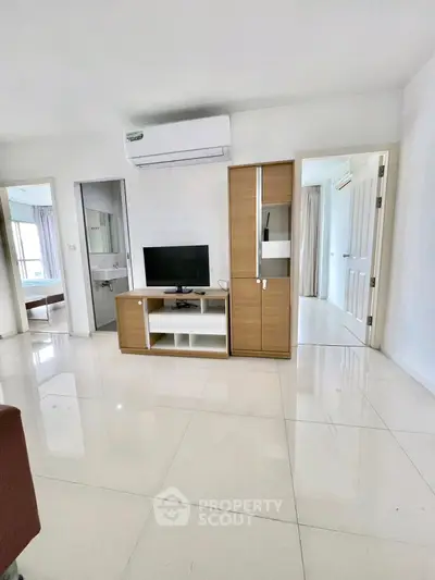 Modern living room with sleek furniture and air conditioning in a bright apartment