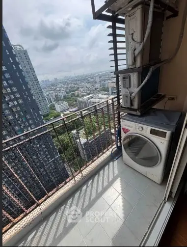 High-rise balcony with city view and washing machine, perfect for urban living.