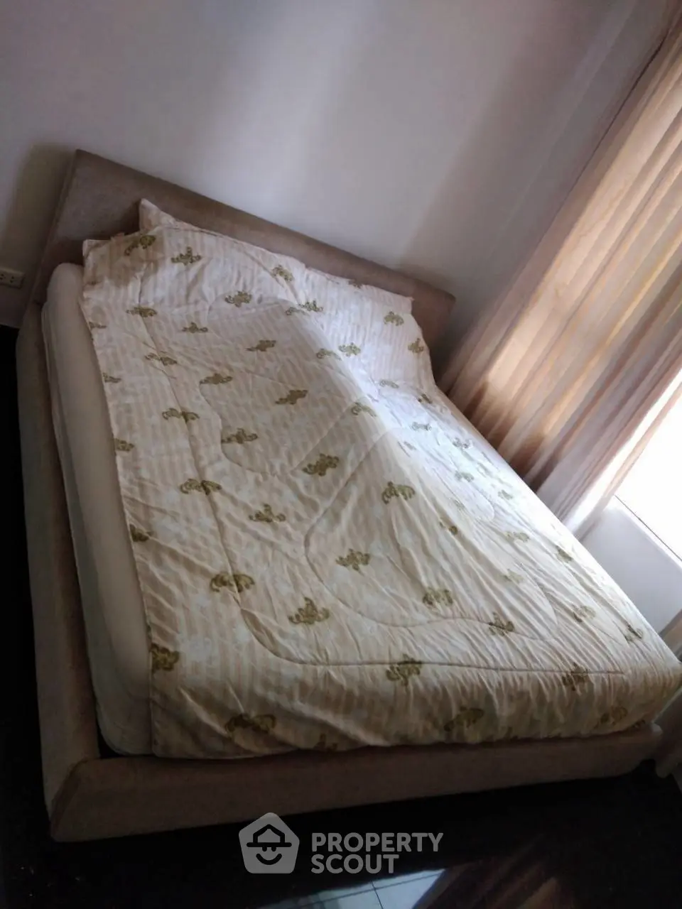 Cozy bedroom with natural light and elegant bedding