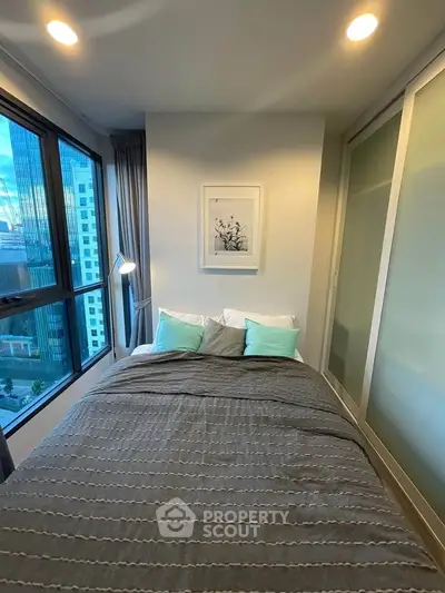 Cozy bedroom with city view and modern decor