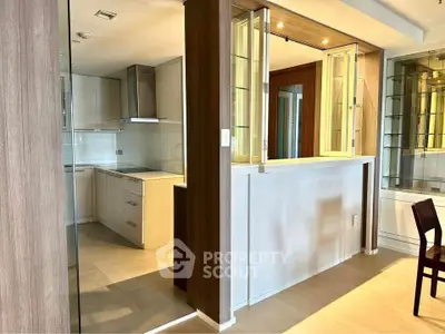 Modern kitchen with open layout and sleek cabinetry in a stylish apartment.
