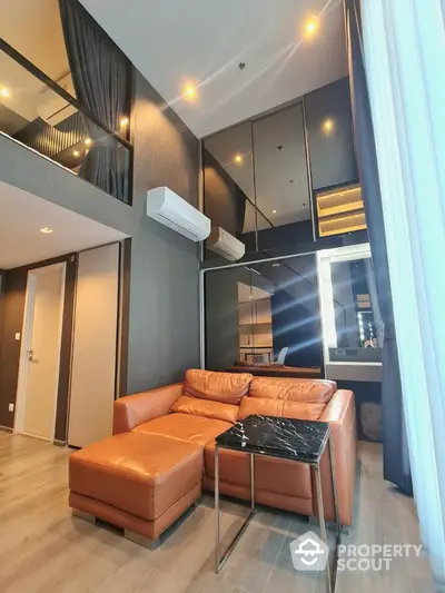 Luxurious modern living room with high ceiling and leather sofa in stylish apartment