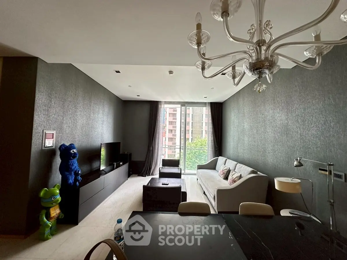 Stylish living room with modern decor and large window offering city views.