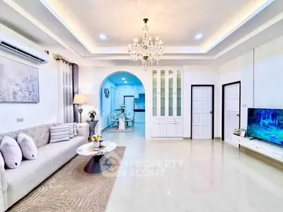 Luxurious living room with elegant chandelier and modern decor