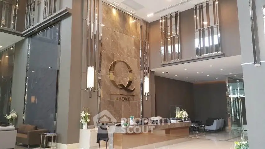 Luxurious modern building entrance with elegant decor and high ceilings