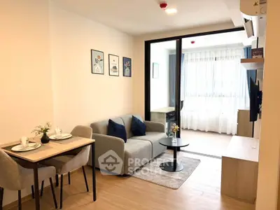 Modern living room with cozy sofa, dining table, and large window for natural light.