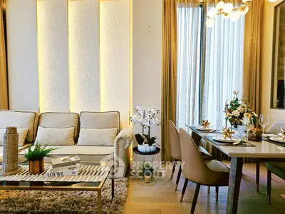 Luxurious living and dining area with elegant decor and natural lighting.