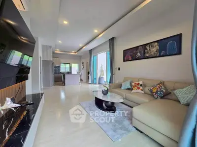 Spacious modern living room with open kitchen and stylish decor