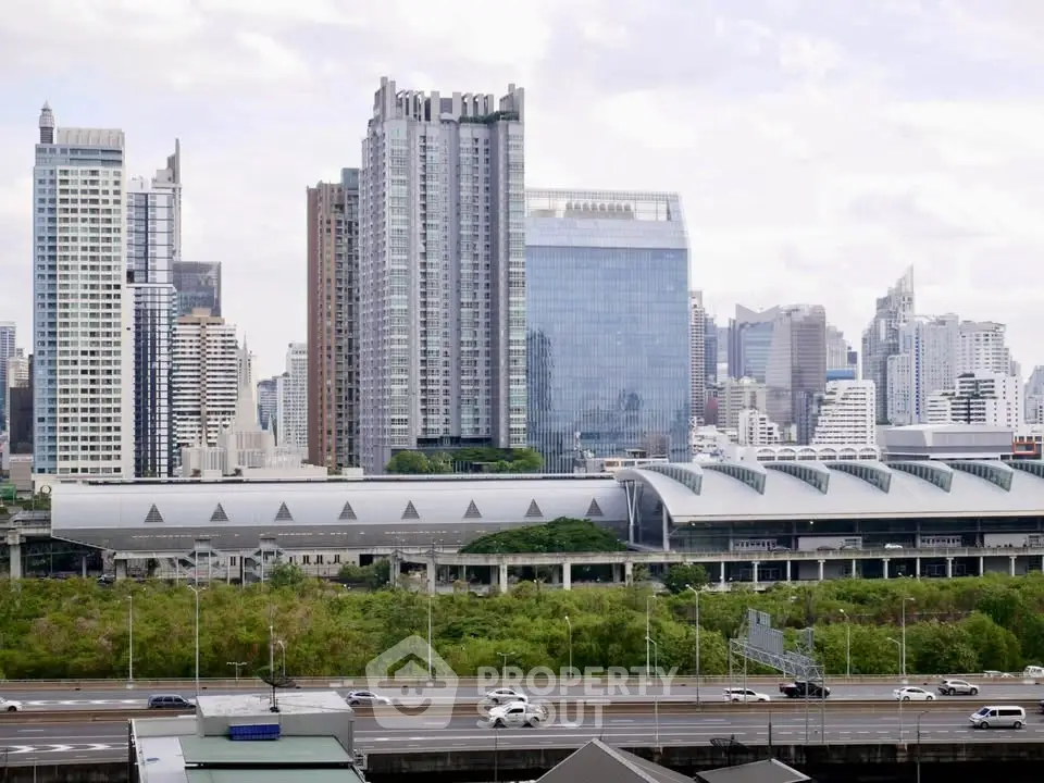 Stunning cityscape view with modern high-rise buildings and lush greenery, perfect for urban living.