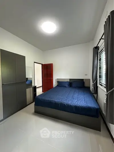 Modern bedroom with sleek furniture and natural light