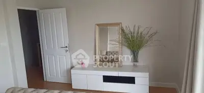 Stylish living room with modern decor and elegant mirror