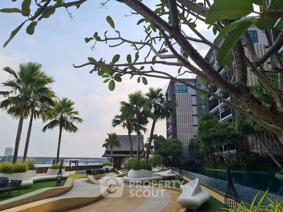 Luxurious tropical garden with modern architecture and palm trees, perfect for relaxation and leisure.