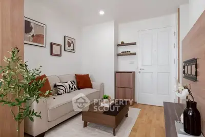 Chic modern living room with cozy sofa, stylish decor, and wooden accents in a compact apartment.