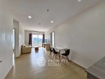 Spacious modern living room with natural light and stylish furniture