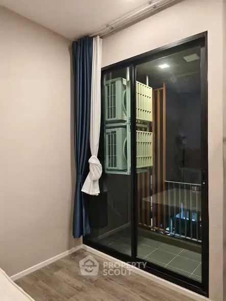 Modern apartment interior with balcony and large window view