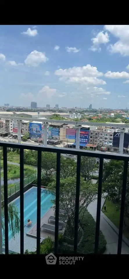 Stunning city view from balcony overlooking pool and skyline