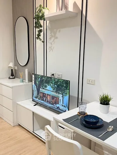 Modern living room with sleek furniture and wall-mounted TV, perfect for cozy relaxation.