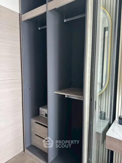 Modern wardrobe with sleek design and ample storage space in a stylish bedroom setting.