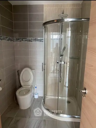 Modern bathroom with sleek shower enclosure and stylish tile design