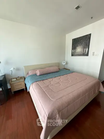 Cozy bedroom with elegant decor and wooden flooring