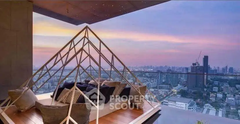 Luxurious rooftop terrace with stunning city skyline view at sunset, featuring cozy seating area.