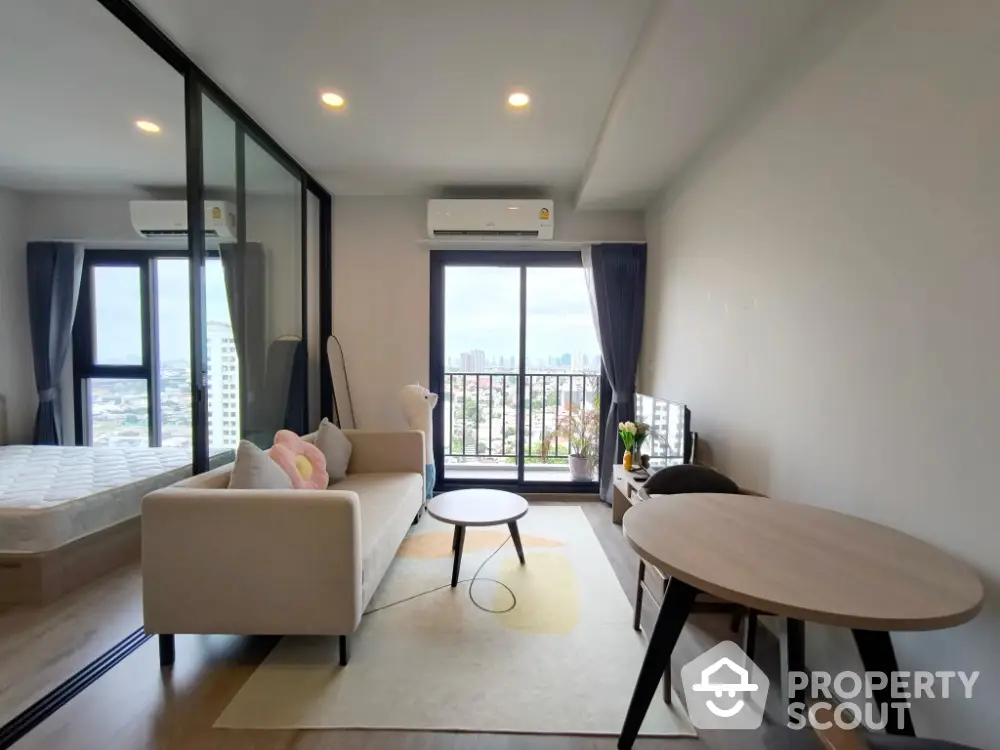 Modern living room with balcony view in high-rise apartment