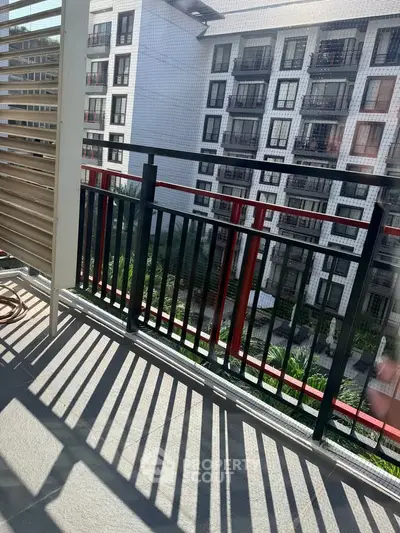 Modern apartment balcony with stylish railing and city view, perfect for urban living.