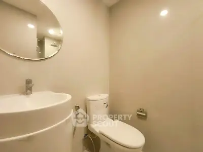 Modern bathroom with sleek fixtures and minimalist design.