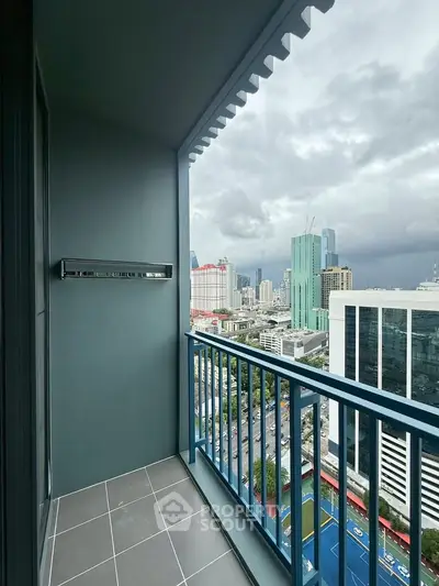 Stunning city view from a modern high-rise balcony, perfect for urban living.