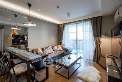 Modern living room with stylish decor and balcony view