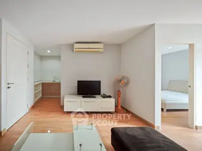 Spacious living room with modern decor and natural light