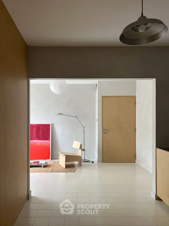 Minimalist interior with modern art and sleek furniture in a stylish living space.