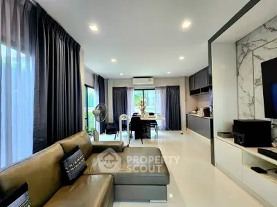 Spacious modern living room with open kitchen and elegant decor