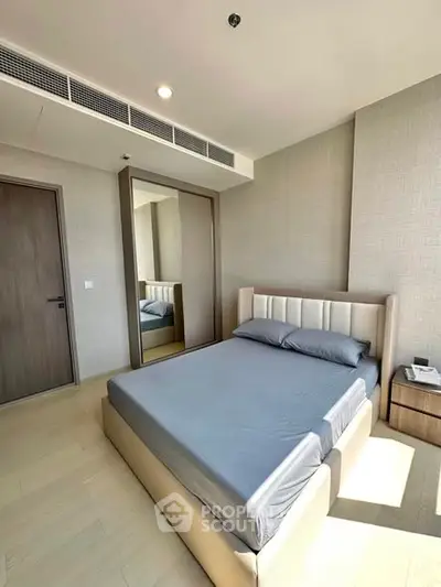 Modern bedroom with sleek design and ample natural light