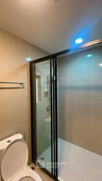 Modern bathroom with glass shower enclosure and sleek design