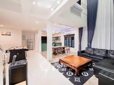 Spacious modern living room with open kitchen and stylish decor
