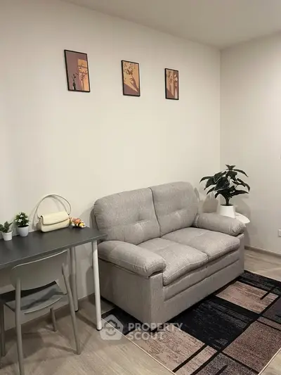 Cozy living room with modern decor and comfortable sofa, perfect for relaxation.