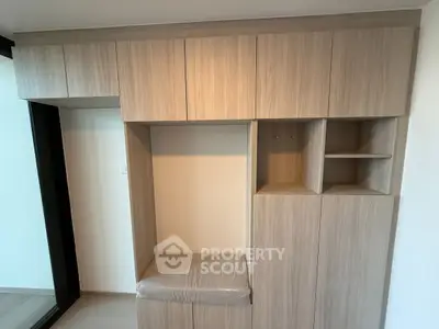 Modern built-in wooden storage unit with sleek design in a contemporary home interior.