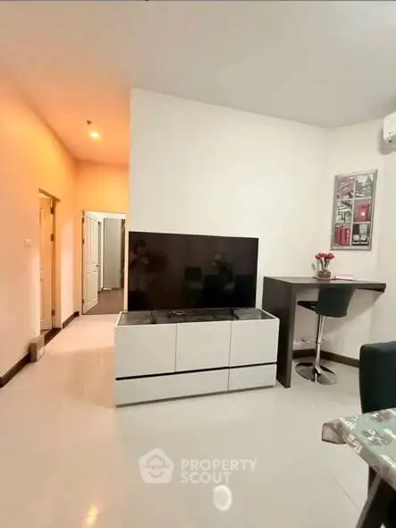 Modern living room with sleek TV stand and bar seating