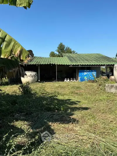 Charming rural property with lush greenery and traditional architecture, perfect for serene living.