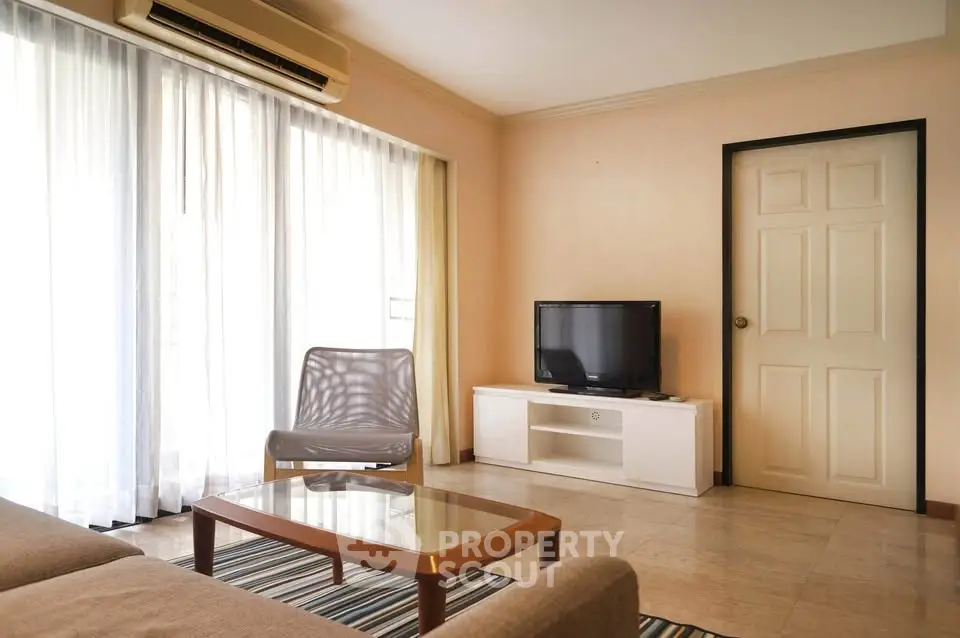 Spacious living room with modern furniture and natural light