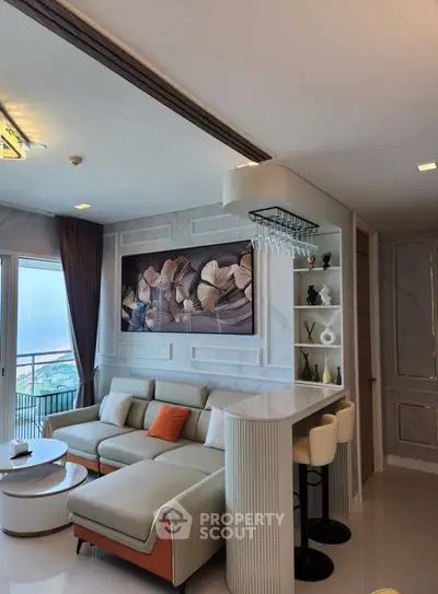 Luxurious living room with modern decor and stunning view, featuring a cozy sofa and elegant bar area.