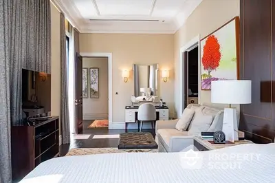 Luxurious bedroom with en-suite bathroom, elegant decor, and modern amenities, perfect for upscale living.